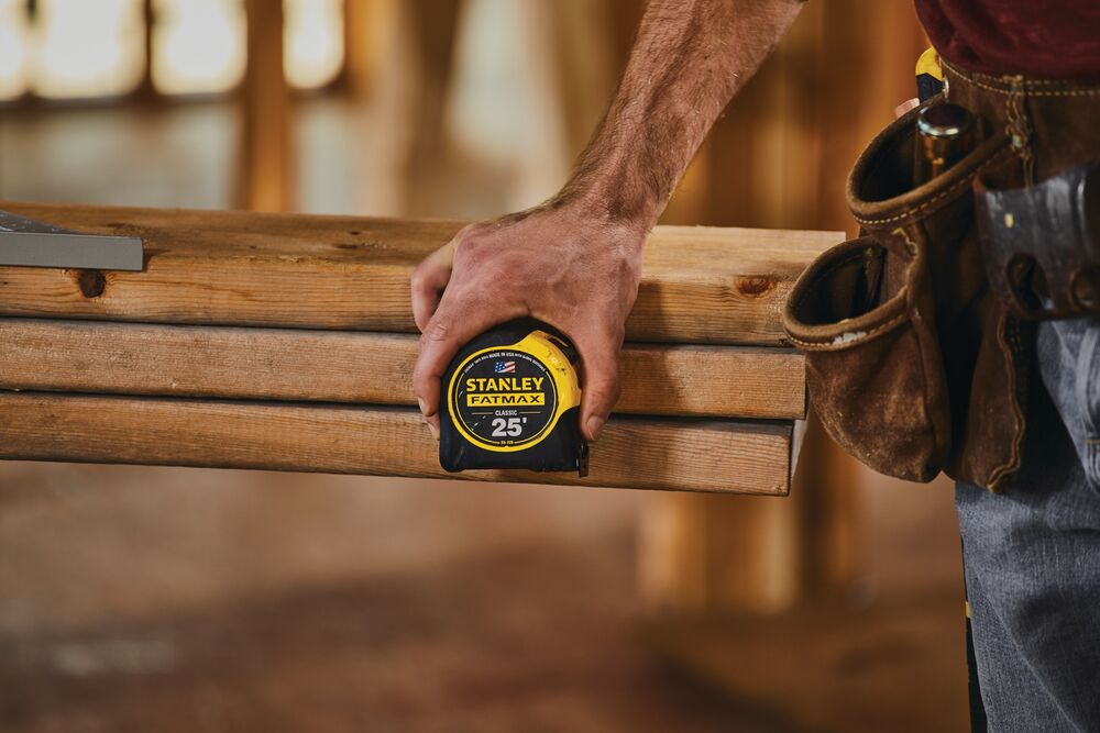 25 foot FATMAX classic tape measure being used by a person.