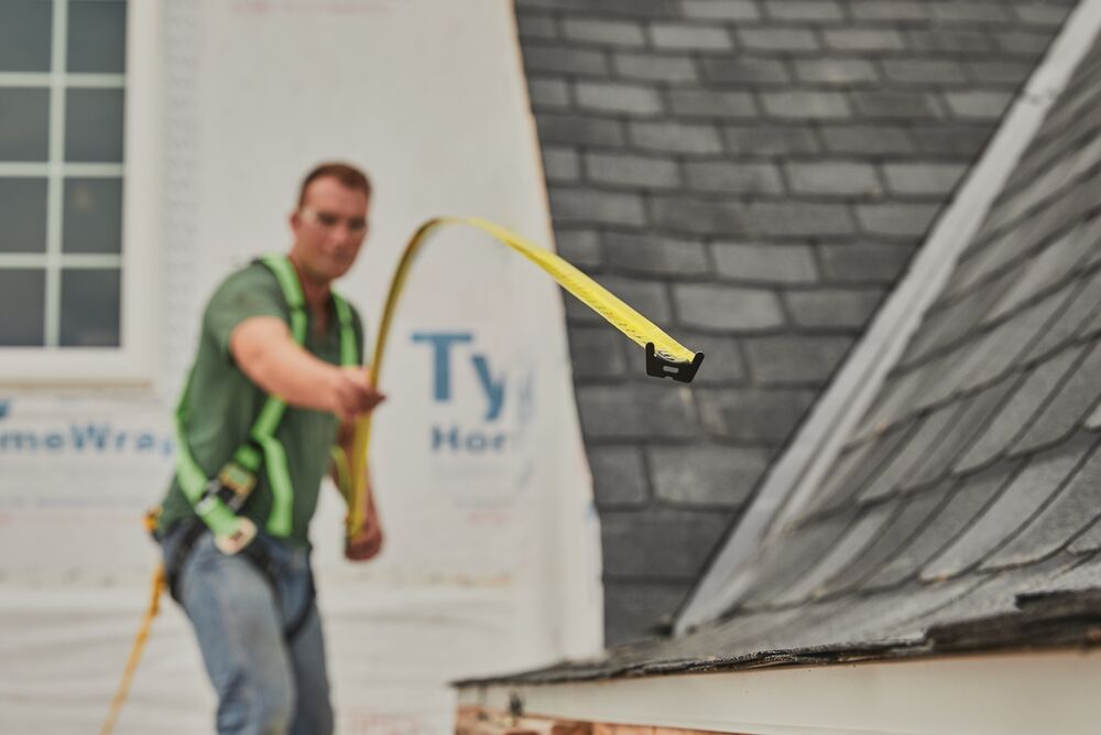 25 foot FATMAX classic tape measure being used by a person to measure distance.