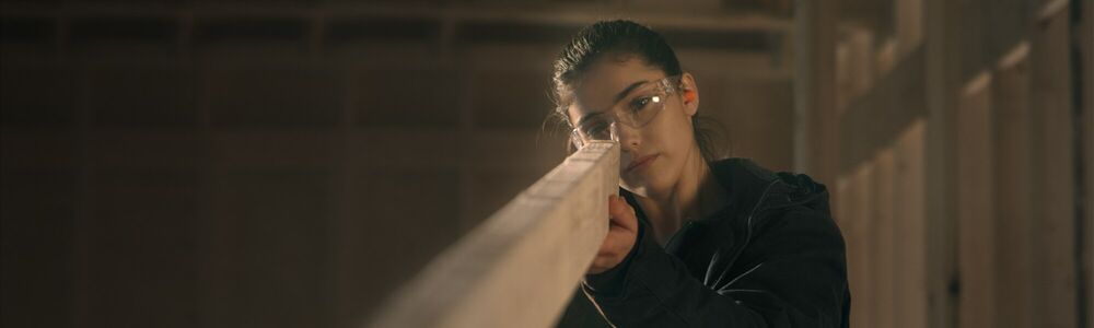 Woodworker build and measure materials.